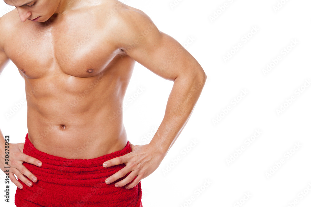 Fit man in red towel, isolated on white background