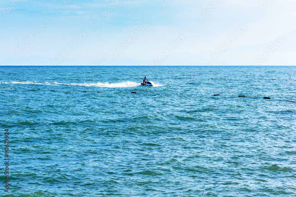 The man drives on the water scooter