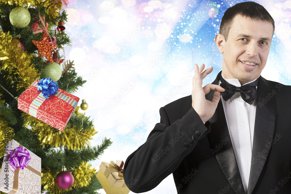 Man in classic tuxedo with gift box.christmas Man in classic tuxedo with gift box.christmas