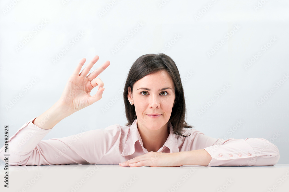Happy smiling beautiful young woman show OK gesture Happy smiling beautiful young woman show OK gesture