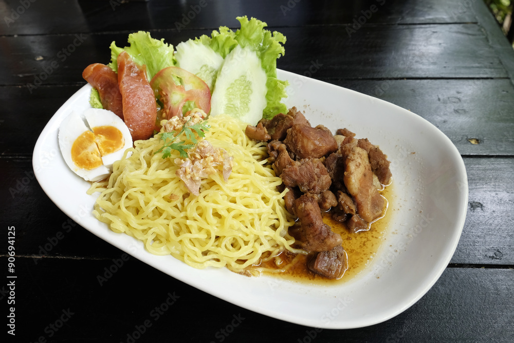 Dry Yellow Noodles with egg, salad, sausage and braised pork Dry Yellow Noodles with egg, salad, sausage and braised pork