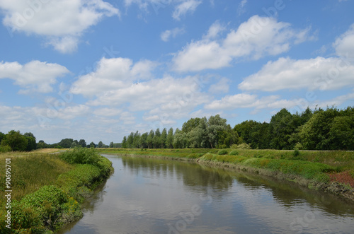 Large river with green shores in flanders