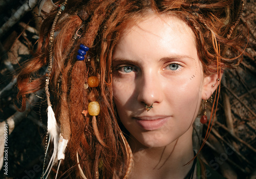 Close up Woman Face with Dreadlocks and Piercing photo