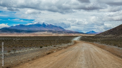 lonely road in the bolivian altiplano