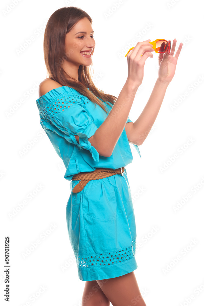 Pretty girl in blue dress with glasses isolate on white backgroun Pretty girl in blue dress with glasses isolate on white backgroun