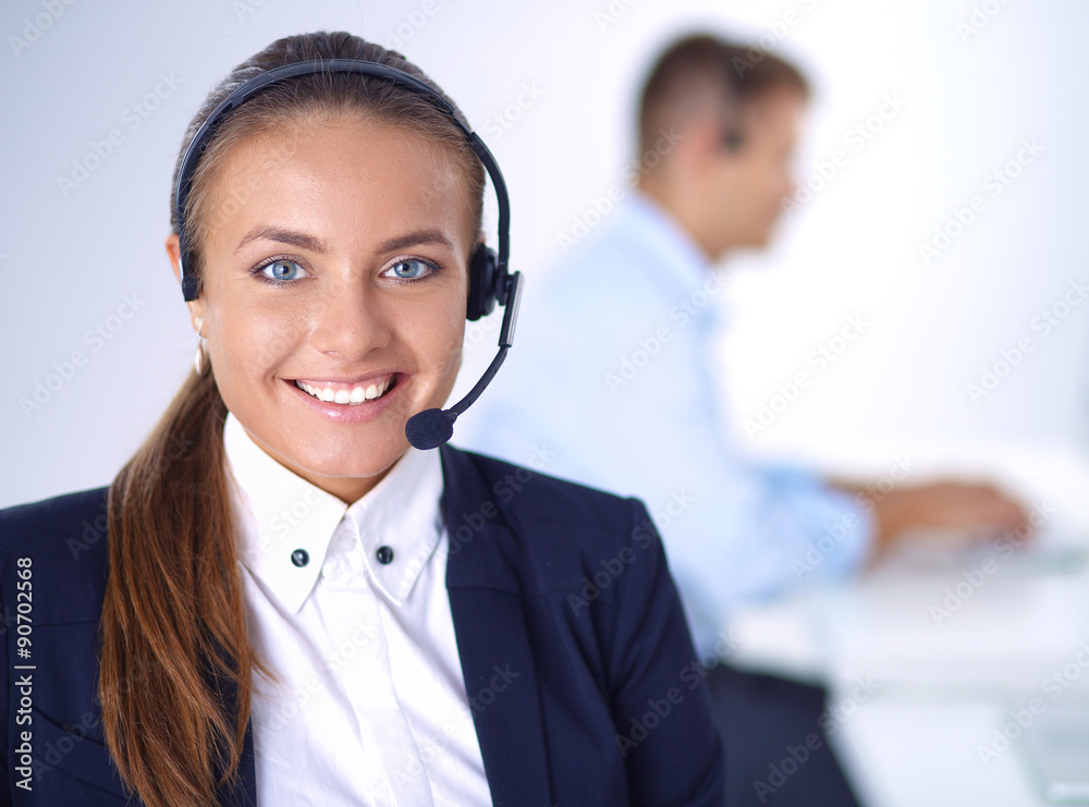 Happy female wearing headset and sitting on the desk Happy female wearing headset and sitting on the desk