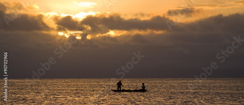 The boat with the fishermen at sunset. Madagascar.