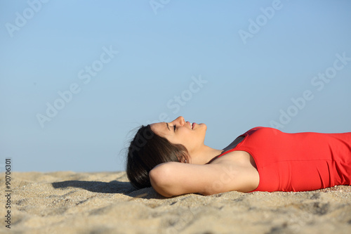 Woman resting and relaxing on the beach