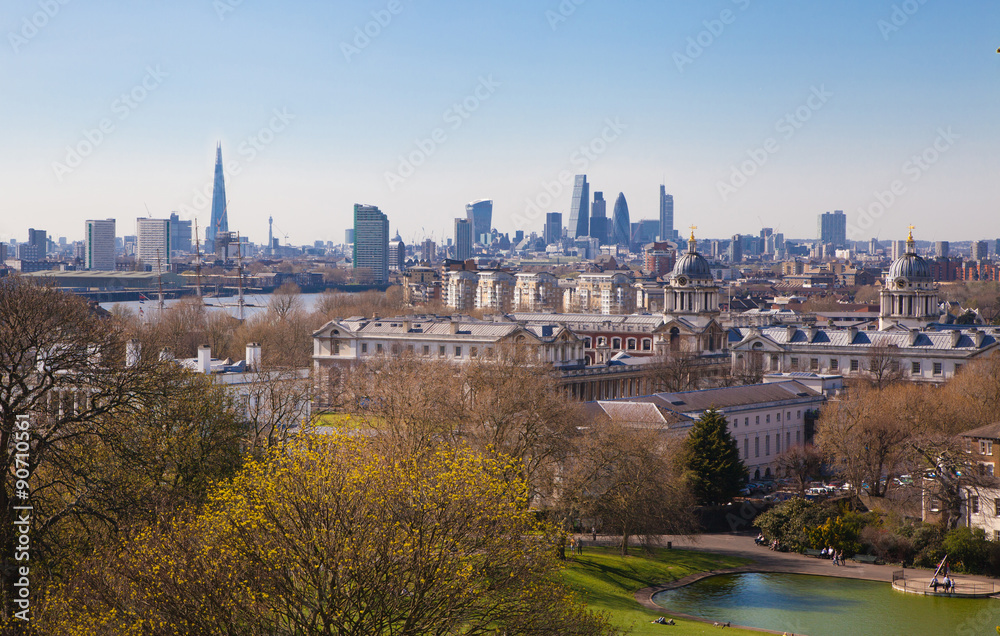 LONDON, UK - APRIL 14, 2015: City of London view from the Greenwich hill. Modern skyscrapers of banking aria
