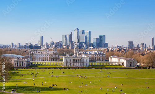 LONDON, UK - APRIL 14, 2015: Canary Wharf view from the Greenwich hill. Modern skyscrapers of banking aria photo