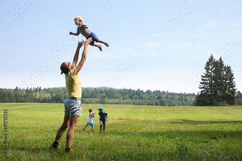 Mother playing with children