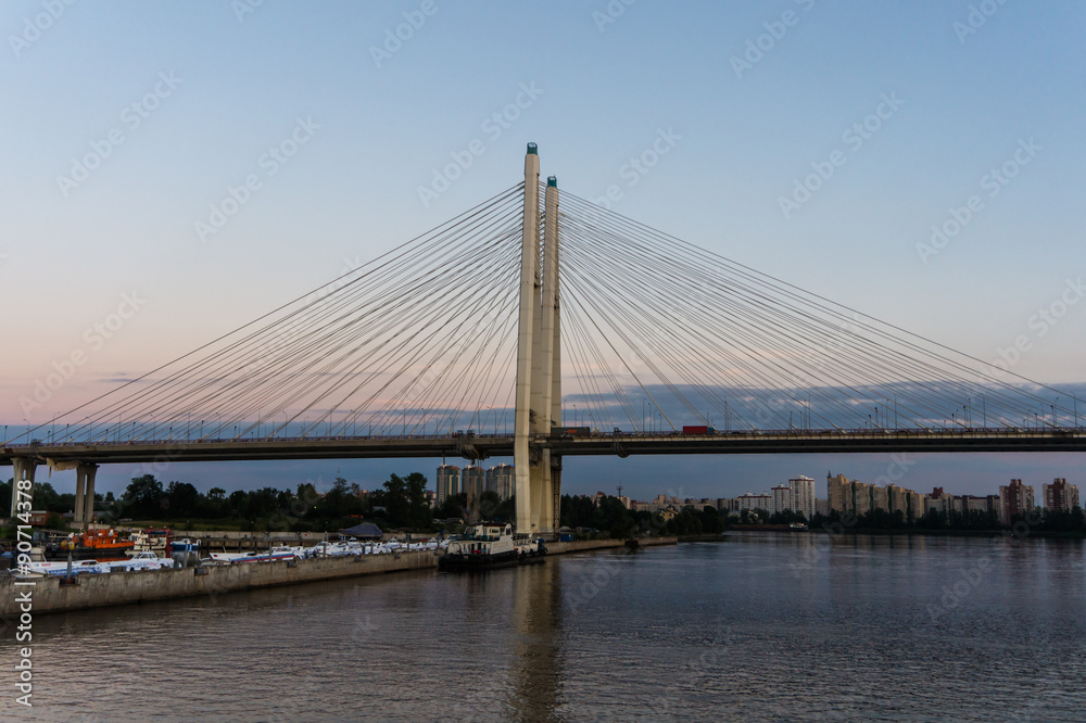 Cable bridge crossing the Neva River with city skyline in the background, St. Petersburg, Russia