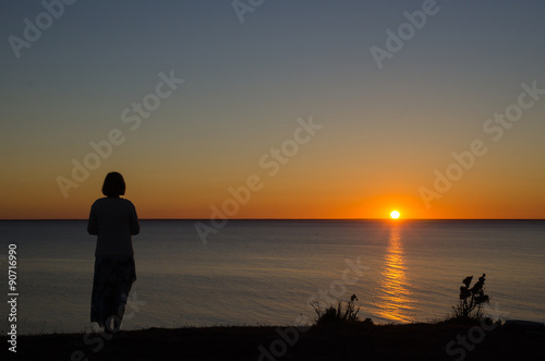 Woman watching sunset