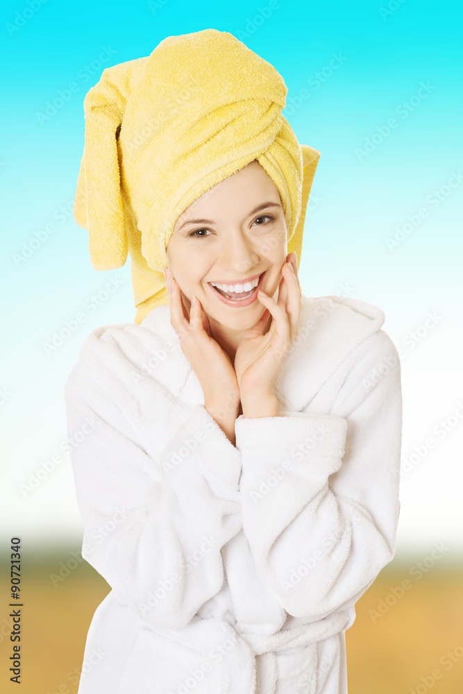 Young smiling woman in bathrobe Young smiling woman in bathrobe