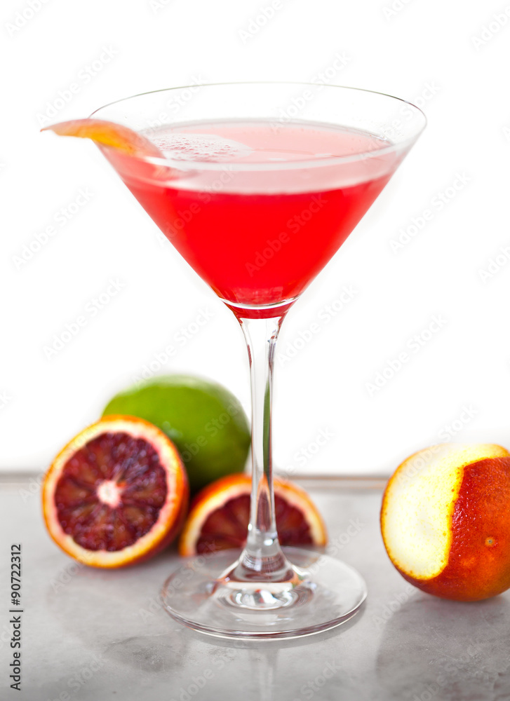 A delicious sweet mixed drink cocktail fruity pink ruby red martini glass blood orange A delicious sweet mixed drink cocktail fruity pink ruby red martini glass blood orange