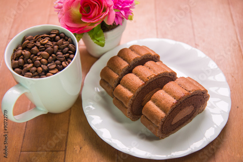 Coffee beans and Chocolate roll cake