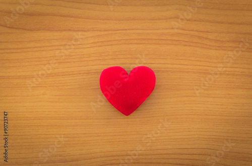 heart on wood background.