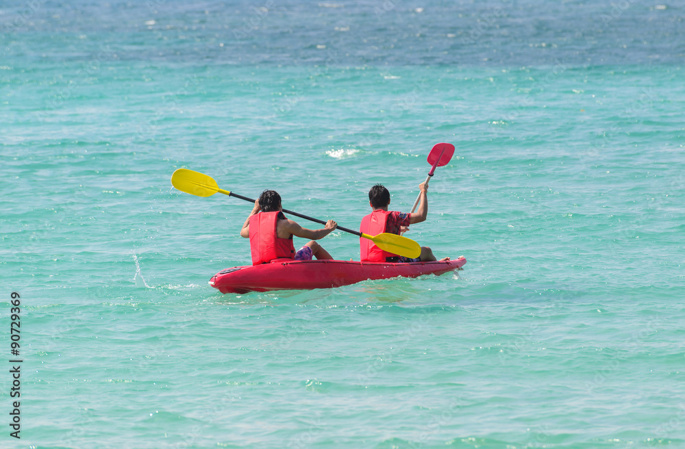 Person Kayaking in sea