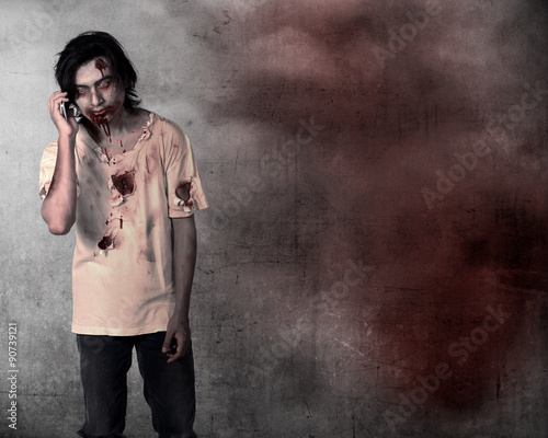 Creepy male zombie talking via cellphone