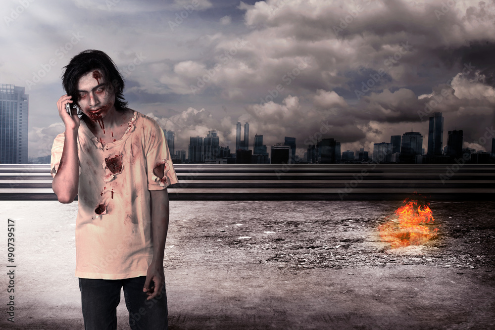 Obraz premium Male zombie call via cellphone