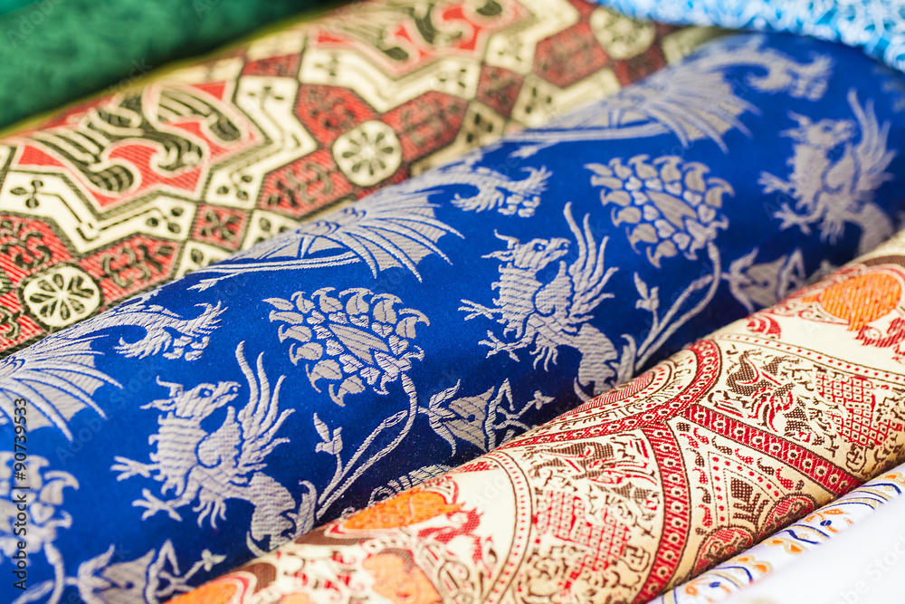 Rolls of fabric and textiles in a factory shop