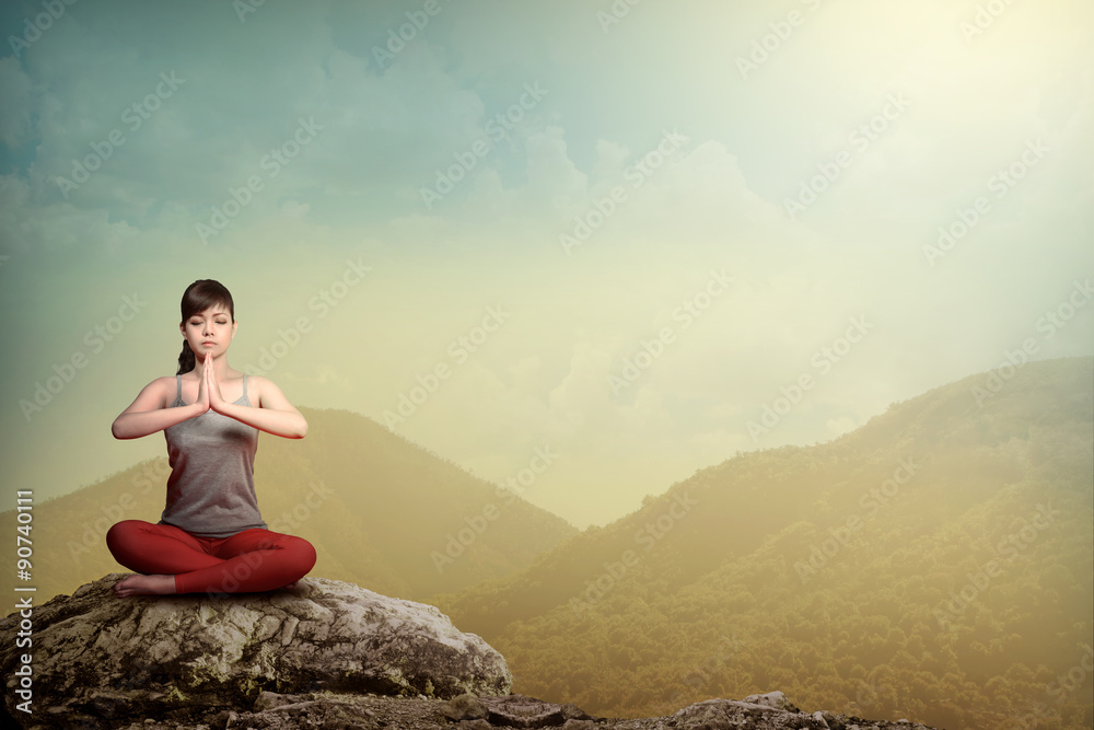 Woman Doing Yoga At The Mountain