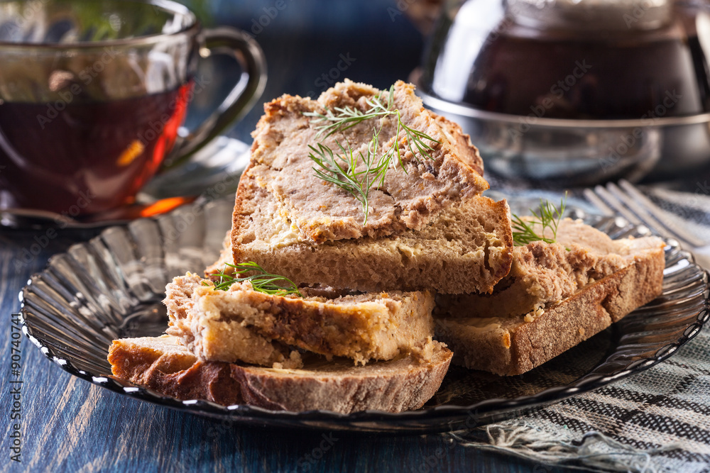 Slices of bread with baked pate on plate Slices of bread with baked pate on plate