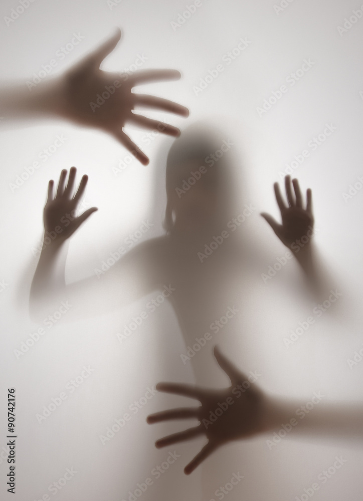 shadow of a girl behind transparent paper