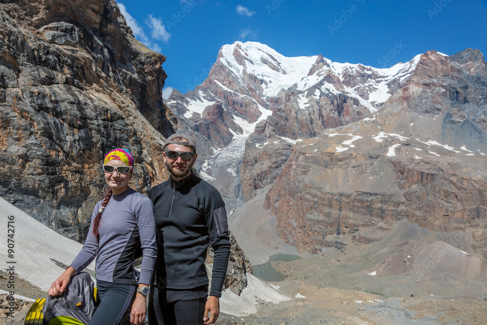 Excited Travelers Young Man and Woman Traveling Outdoor Expressing Fun and Pleasure Casual Sporty Style Clothing Majestic Himalaya Mountain Landscape on Background