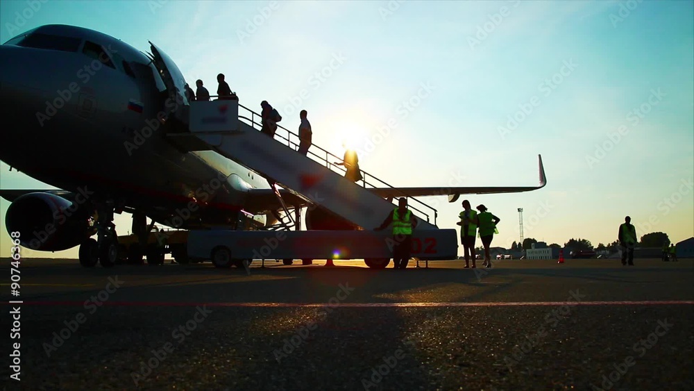People climb the ladder into the plane, airport People climb the ladder into the plane, airport
