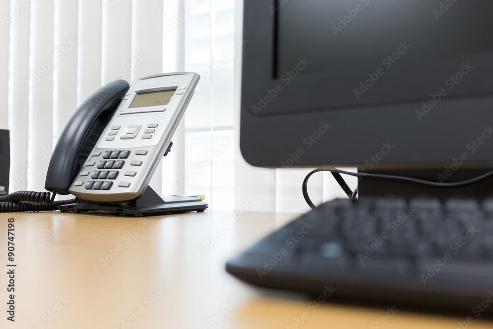 telephone and computer on table work of room service office telephone and computer on table work of room service office