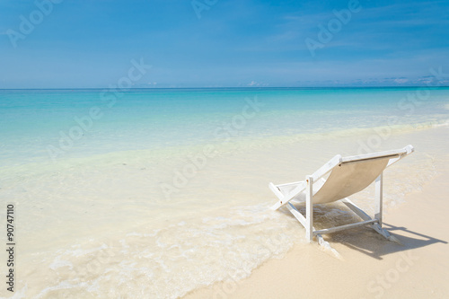 beach chair on beach with blue sky © topntp