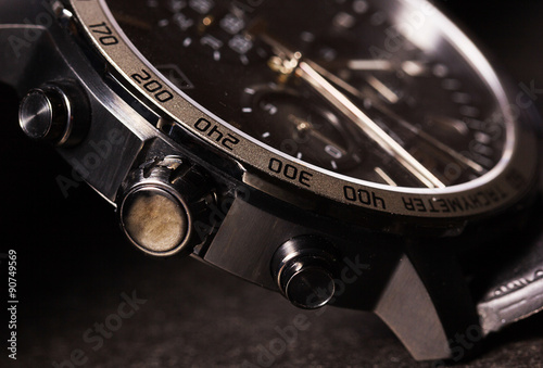 Closeup of man watch on a black background