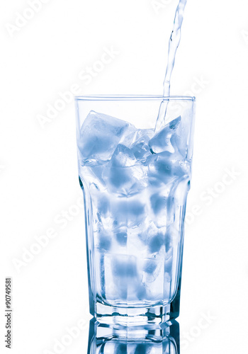 Glass of pure water with ice cubes. Isolated on white