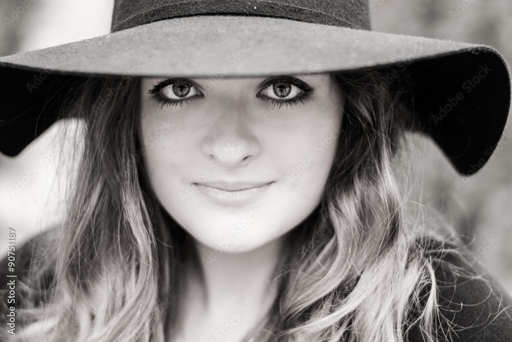 Young girl with big beautiful eyes in black hat Young girl with big beautiful eyes in black hat