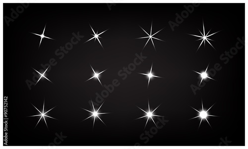 Set of Vector sparkling and glowing light effect stars on black