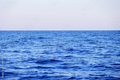 Blue sea with waves and clear blue sky © Africa Studio