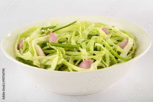 Tasty appetizer cabbage salad. Selective focus photograph.