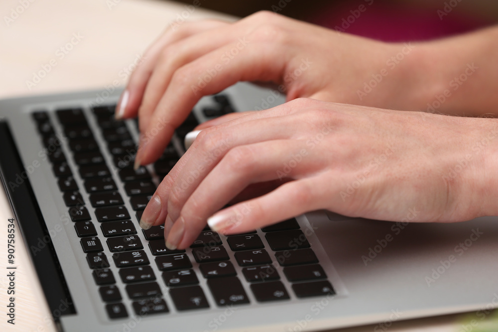 Woman using laptop on workplace close up Woman using laptop on workplace close up