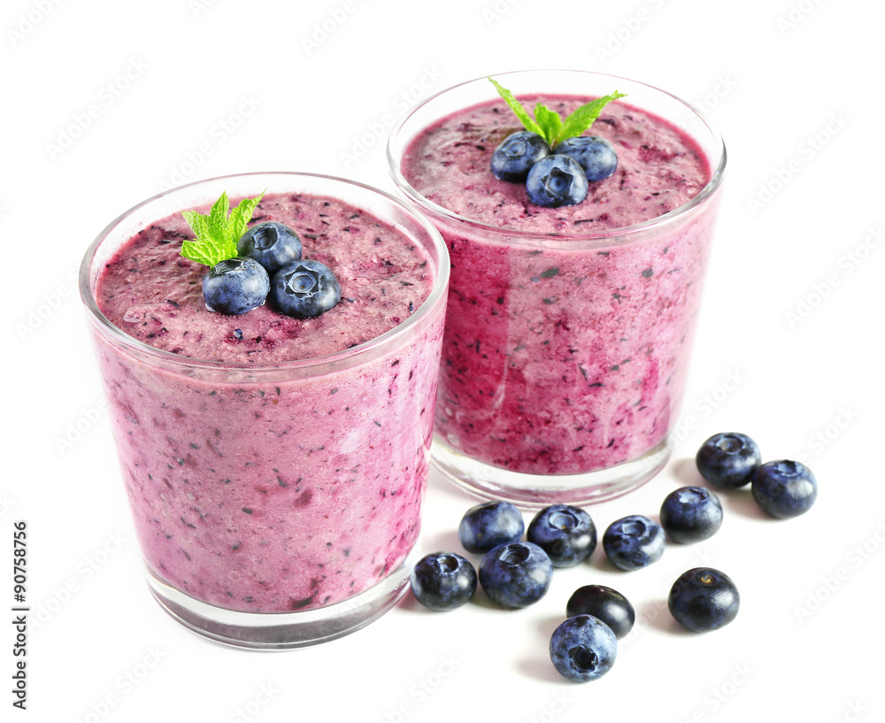 Glass of blueberry smoothie isolated on white Glass of blueberry smoothie isolated on white