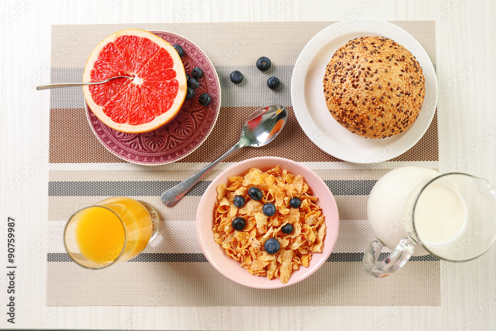 Healthy breakfast with fruits and berries on table close up Healthy breakfast with fruits and berries on table close up