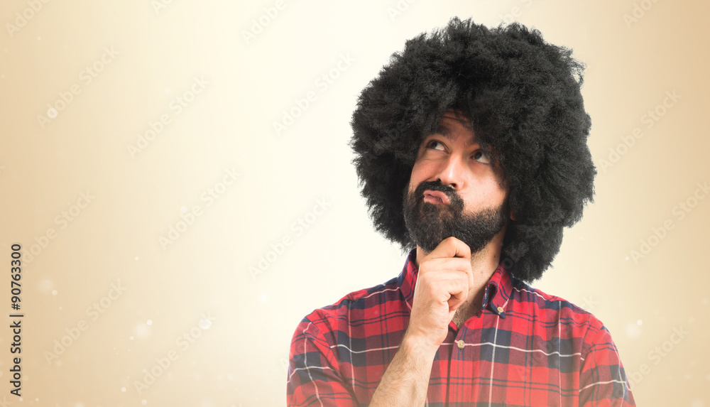 Afro man thinking over white background Afro man thinking over white background