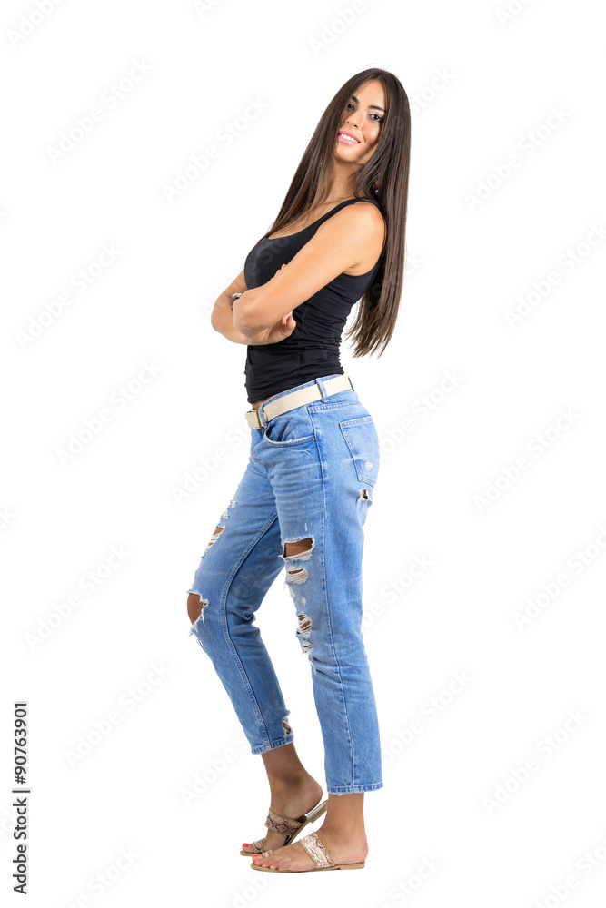 Young Latin happy smiling woman with folded arms looking at camera Young Latin happy smiling woman with folded arms looking at camera