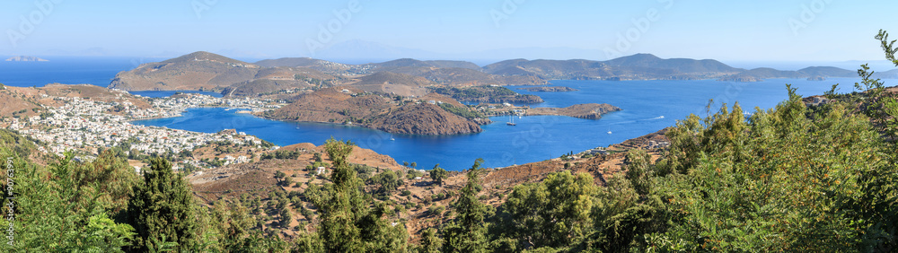 Island Patmos in the Dodecanese archipelago - considered to be sacred because here St. John described a vision of the Apocalypse. Panorama of  island & port Skala seen from the Monastery of Saint John