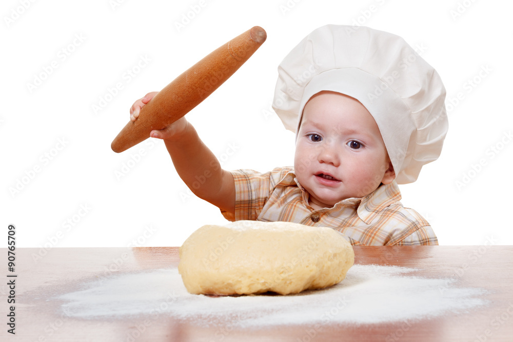 Cute kid rolls cook pizza dough. Isolated on white background Cute kid rolls cook pizza dough. Isolated on white background