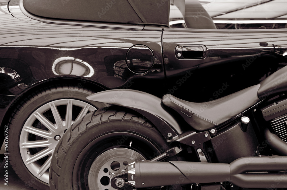 Detail stylish black car and motorcycle. Lifestyle. (Opposites,