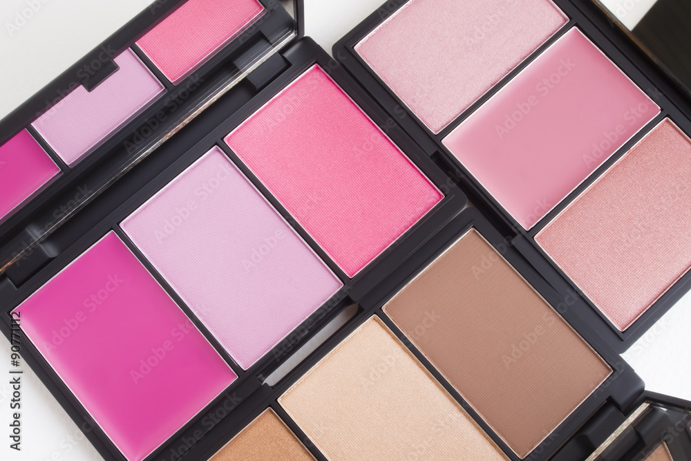 Top view of pink and brown tone blusher palette  make up with white background