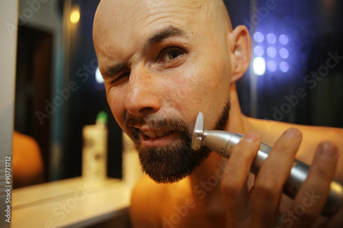 portrait of a man shaving trimer