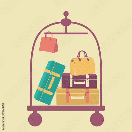 luggage cart with suitcases and bags