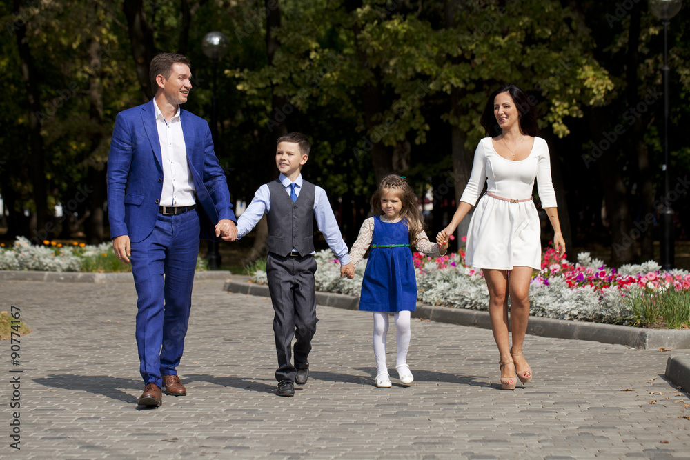 Happy Family Walking Along Suburban Street Happy Family Walking Along Suburban Street